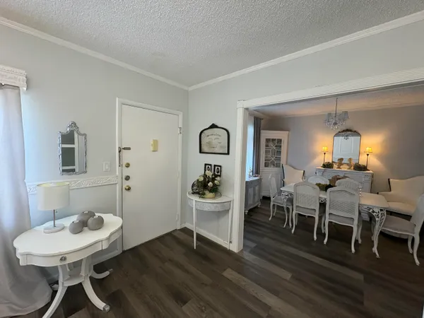 a view of a livingroom with furniture and wooden floor