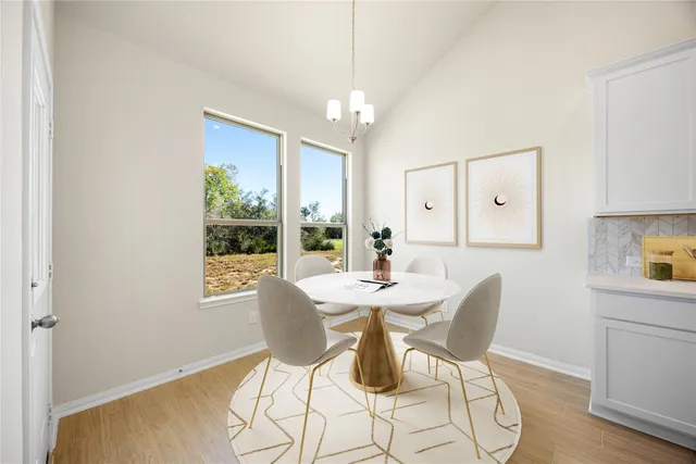 a view of a dining room with furniture window and outside view