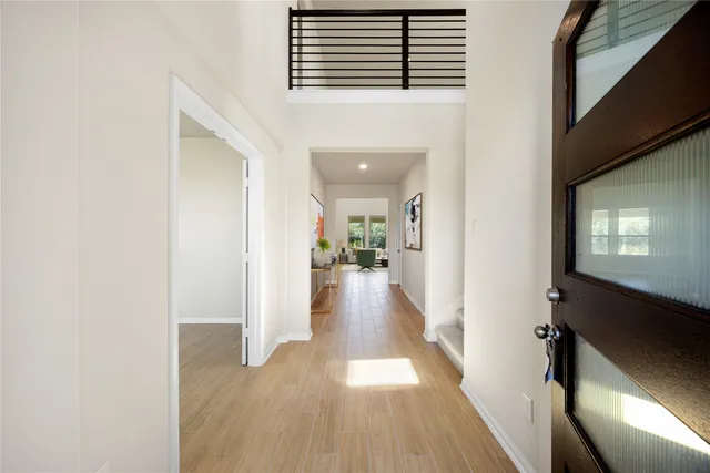a living room with furniture a rug and white walls