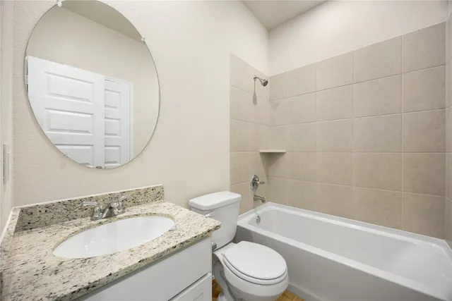a bedroom with a large bed and potted plant