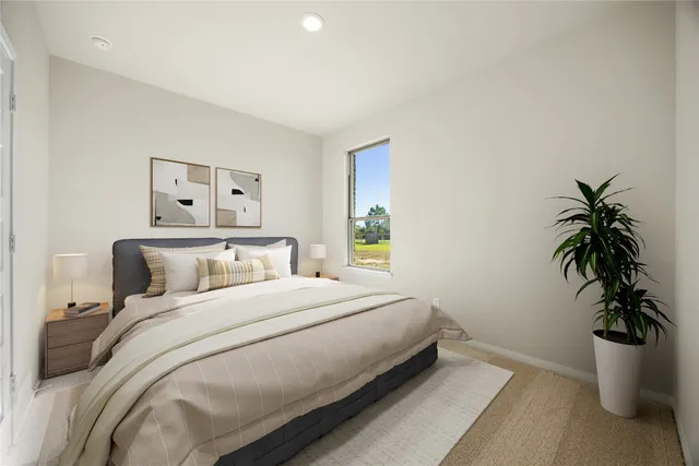 a living room with furniture wooden floor and a potted plant