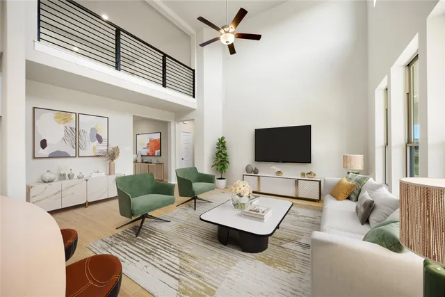 a living room with furniture kitchen view and a chandelier