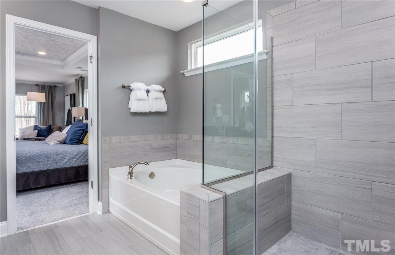 1720 Highpoint Street, Unit HV 264 Wake Forest, NC 27587 - Photo 20 of 20 a bathroom with a tub and a shower