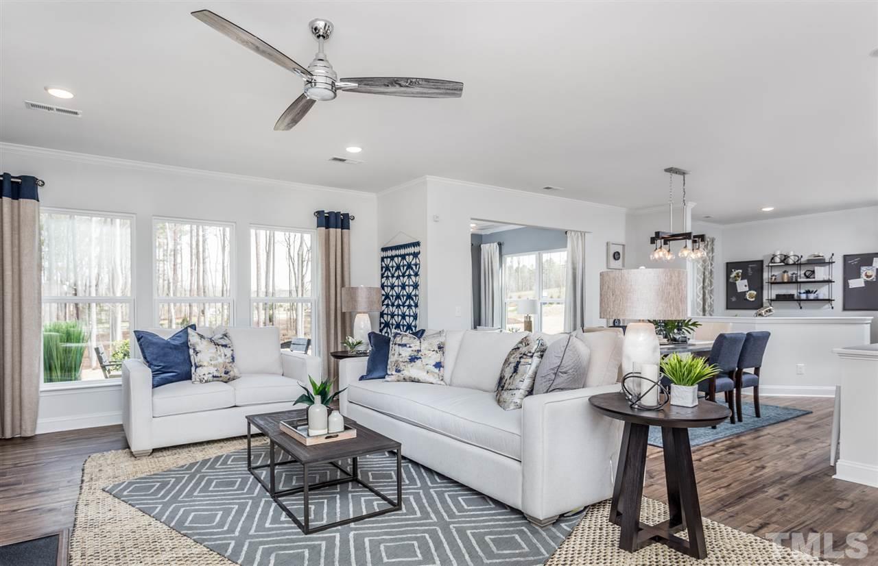 1720 Highpoint Street, Unit HV 264 Wake Forest, NC 27587 - Photo 6 of 20 a living room with furniture and a large window