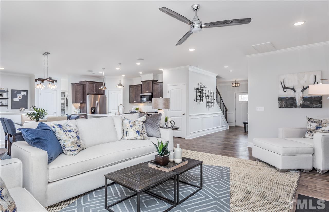 1720 Highpoint Street, Unit HV 264 Wake Forest, NC 27587 - Photo 7 of 20 a living room with furniture and wooden floor