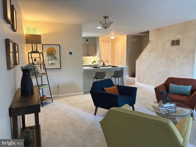 a living room with furniture and a table