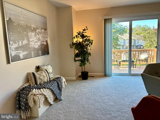 a view of a livingroom with furniture and window