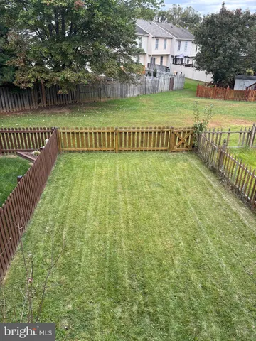 a spacious bedroom with a bed and a chandelier