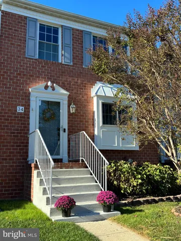 a view of front door and small yard