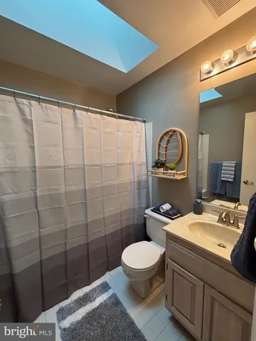 a view of a livingroom with furniture and a ceiling fan
