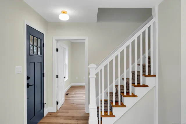 a view of staircase with wooden floor and staircase