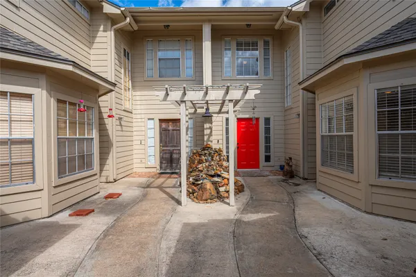a view of a house with basketball court