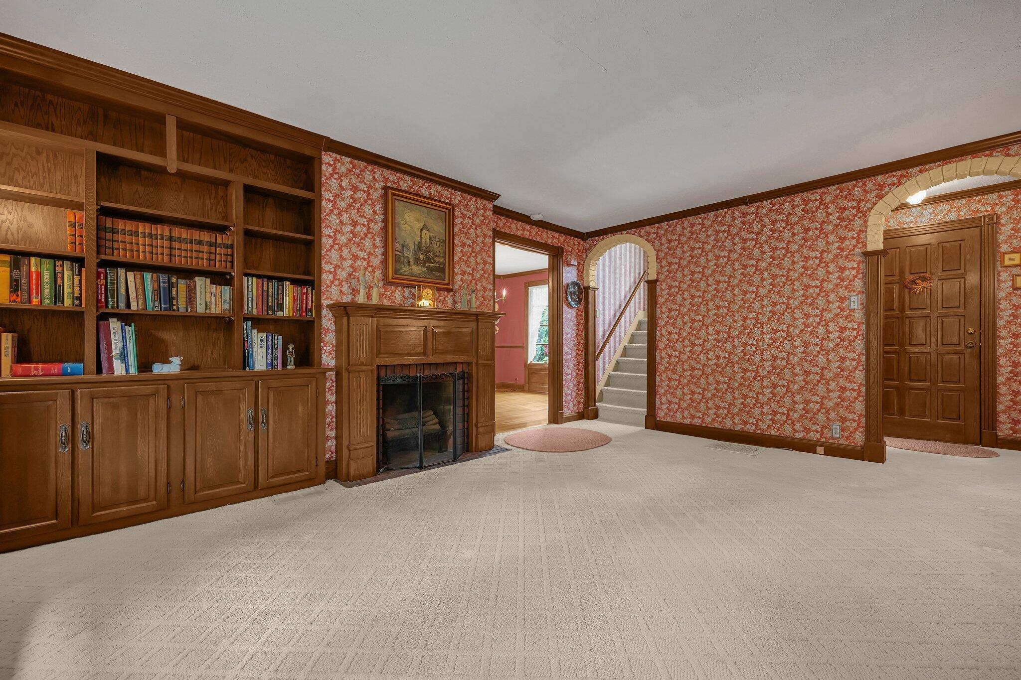 1113 Shady Lane Road Columbus, OH 43227 - Photo 6 of 29 Living room with Wood burning fireplace and built in book shelves