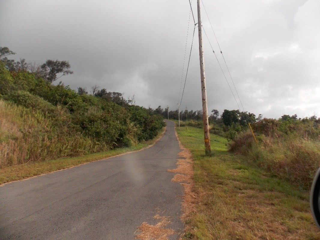 11 Lot Captain Cook, HI 96704 - Photo 2 of 5 a view of a lake with a large bridge