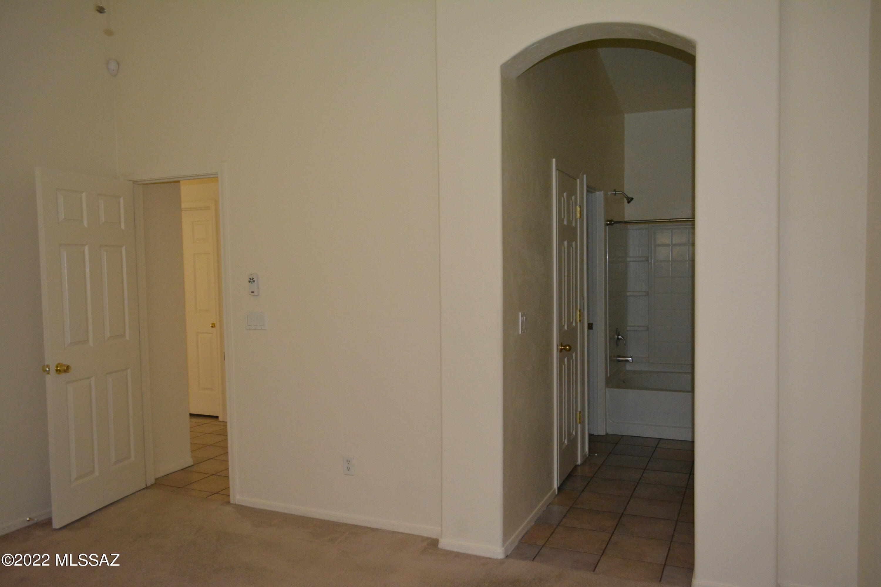 1714 Camino Rivera Rio Rico, AZ 85648 - Photo 12 of 26 a view of a bathroom from a hallway