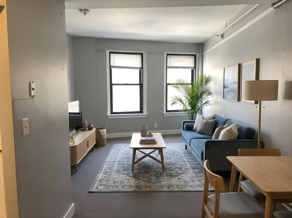 a living room with furniture and a window