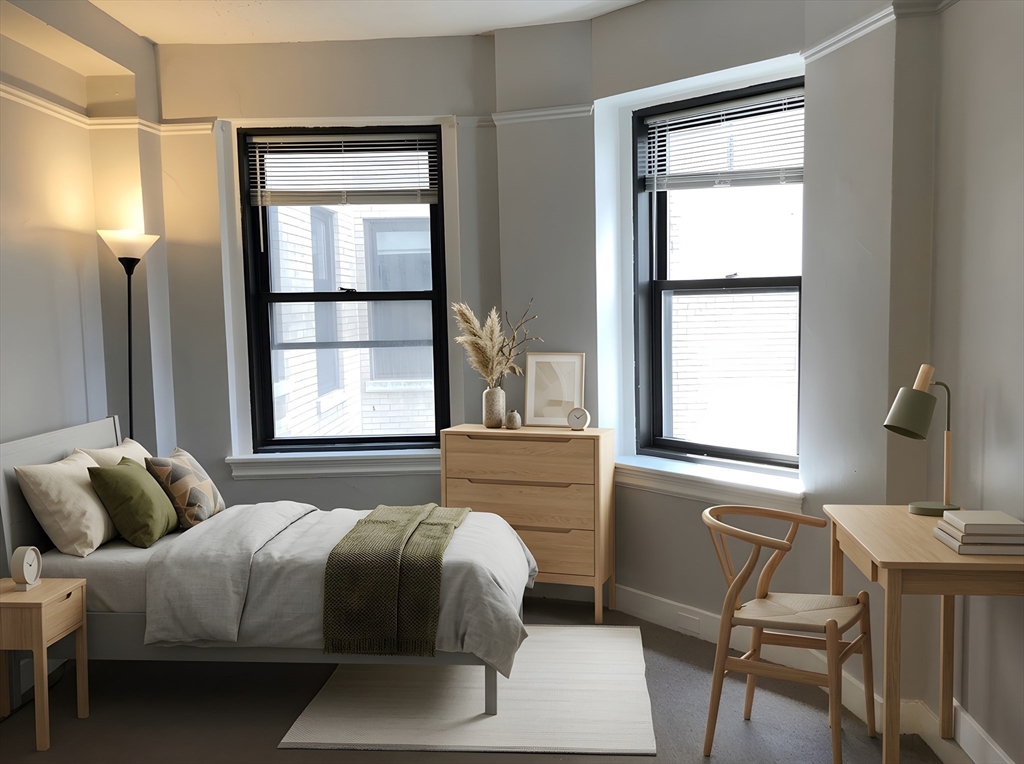 475 Commonwealth Avenue, Unit 306 Boston, MA 02215 - Photo 3 of 11 a bedroom with a bed and a window