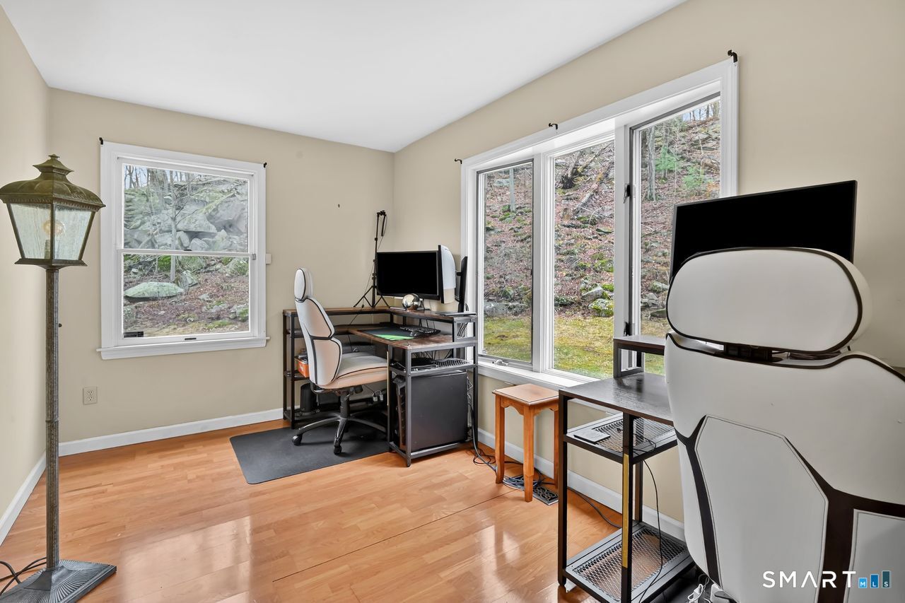 104 Old Farms Road Glastonbury, CT 06073 - Photo 16 of 40 a workspace with furniture and a window
