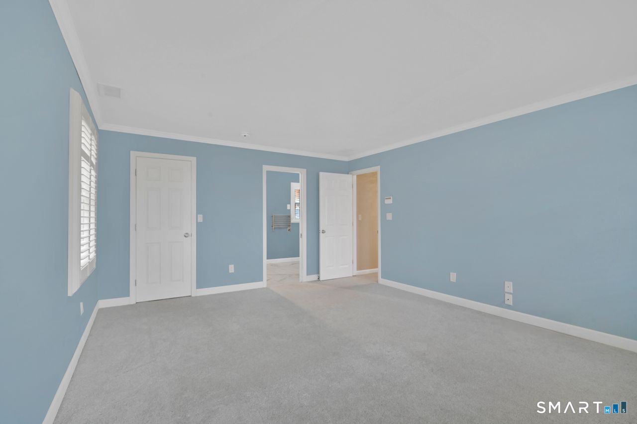 104 Old Farms Road Glastonbury, CT 06073 - Photo 24 of 40 a view of an empty room with window and bathroom
