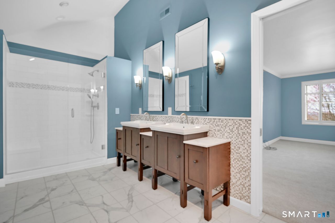 104 Old Farms Road Glastonbury, CT 06073 - Photo 26 of 40 a bathroom with a sink and a mirror