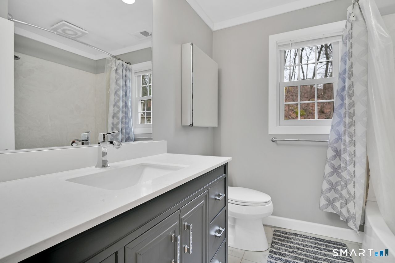 104 Old Farms Road Glastonbury, CT 06073 - Photo 27 of 40 a bathroom with a sink toilet and shower