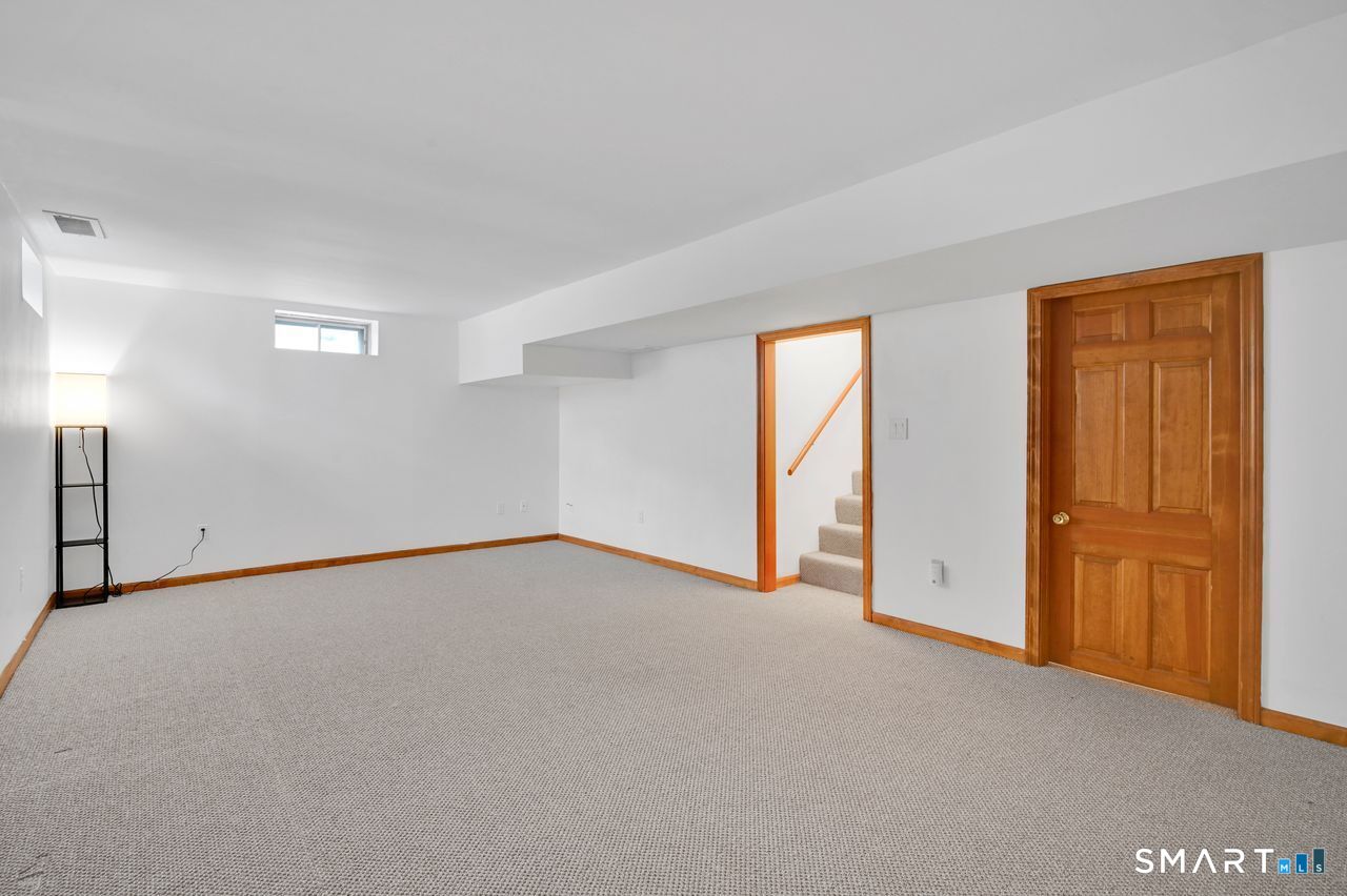 104 Old Farms Road Glastonbury, CT 06073 - Photo 37 of 40 wooden floor in an empty room with a window