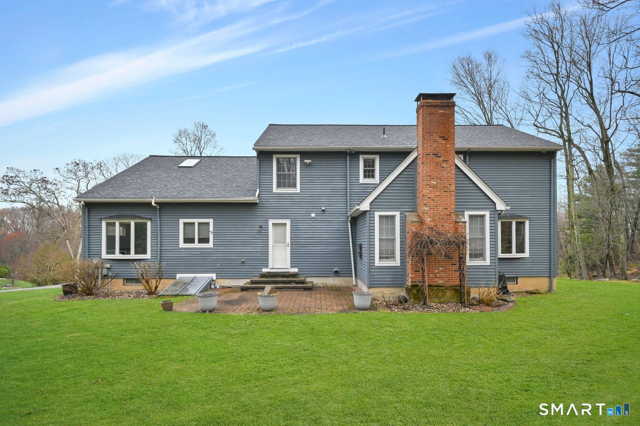 104 Old Farms Road Glastonbury, CT 06073 - Photo 4 of 40 a front view of house with yard and trees
