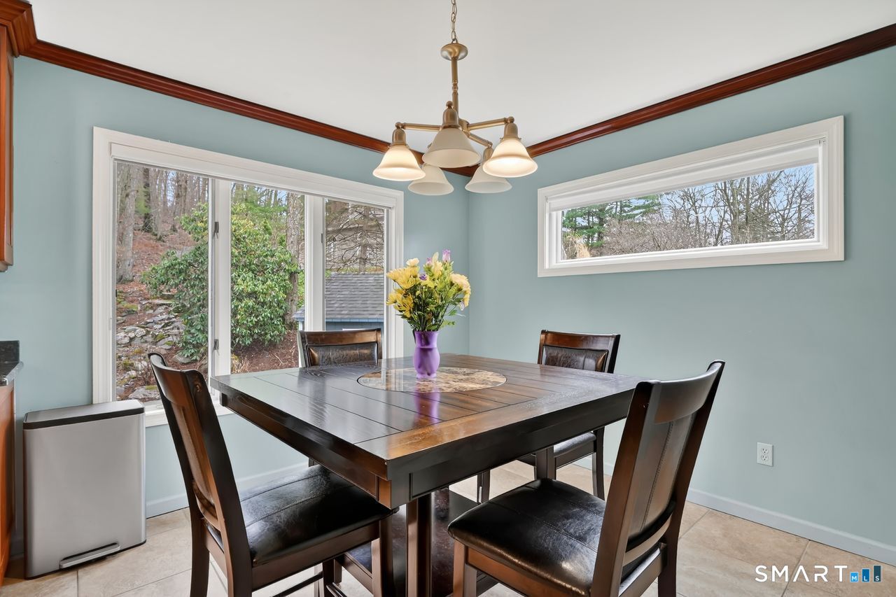 104 Old Farms Road Glastonbury, CT 06073 - Photo 10 of 40 a view of a dining room with furniture window and outside view