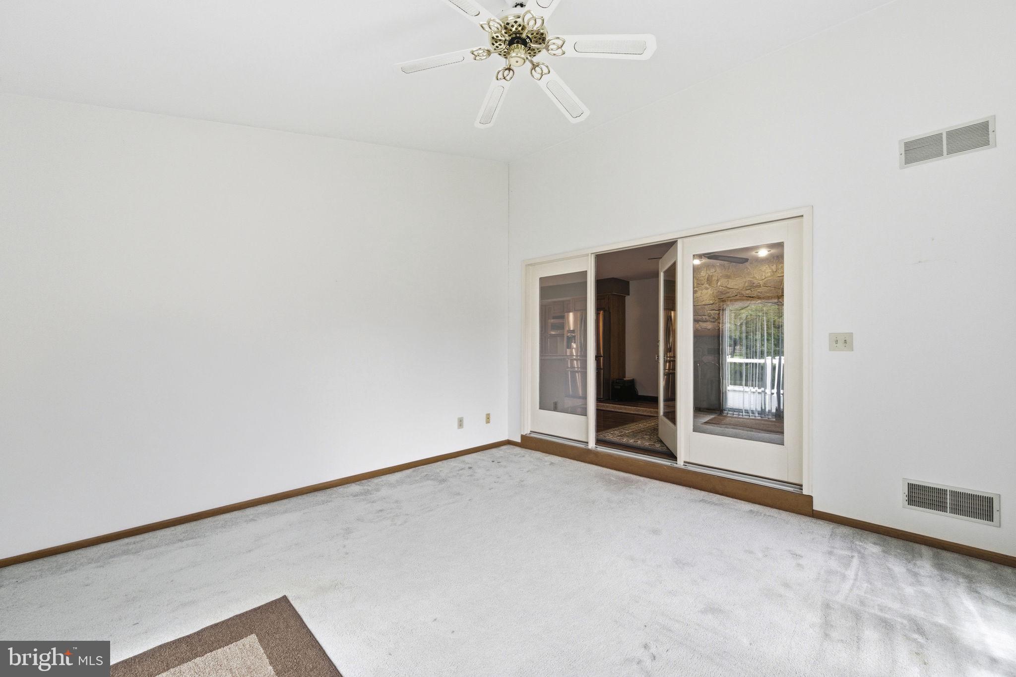 736 Letitia Drive Hockessin, DE 19707 - Photo 46 of 92 an empty room with chandelier fan