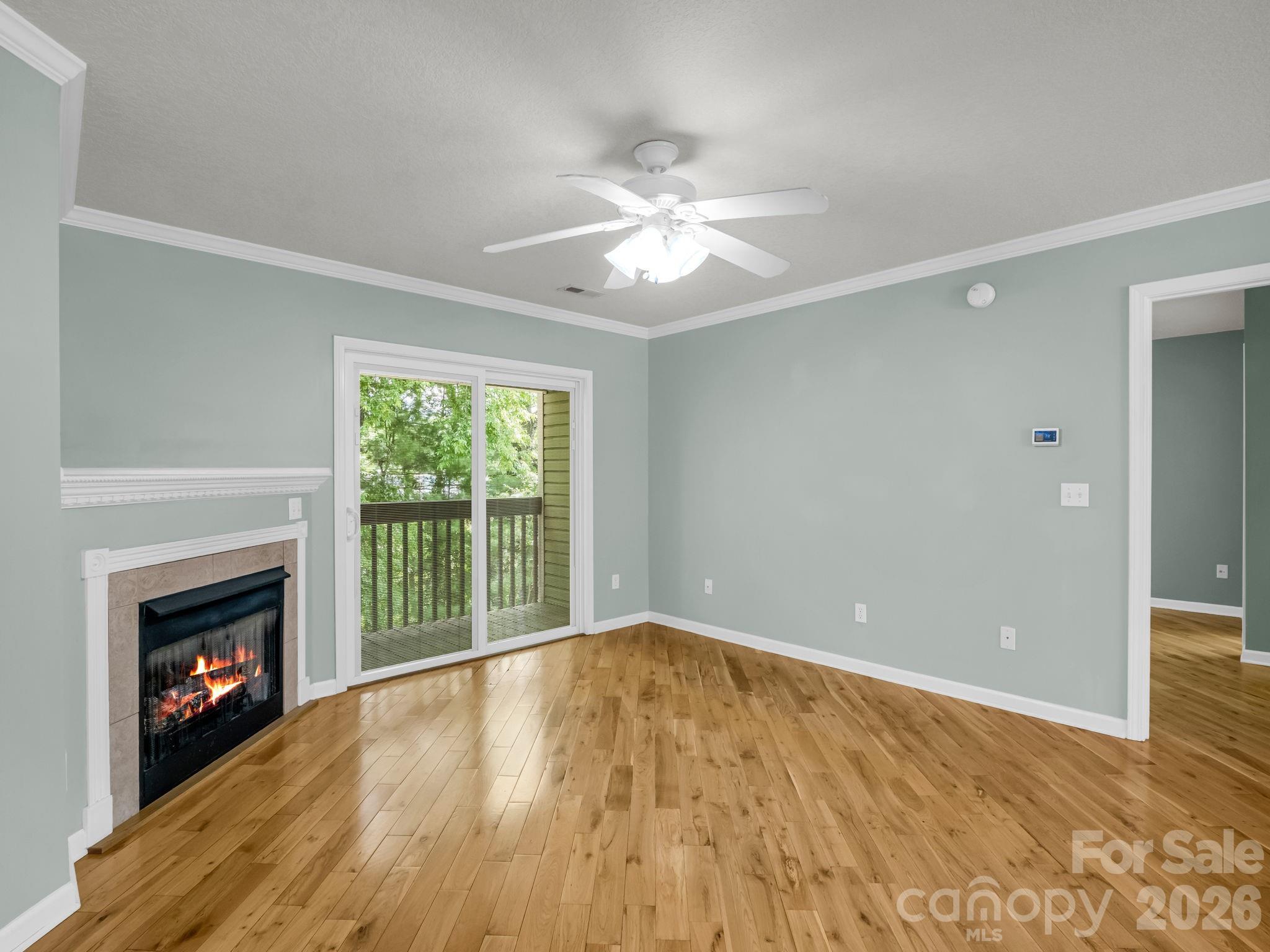 4 Rathfarnham Road, Unit 4F Asheville, NC 28803 - Photo 11 of 33 a view of empty room with wooden floor and fireplace