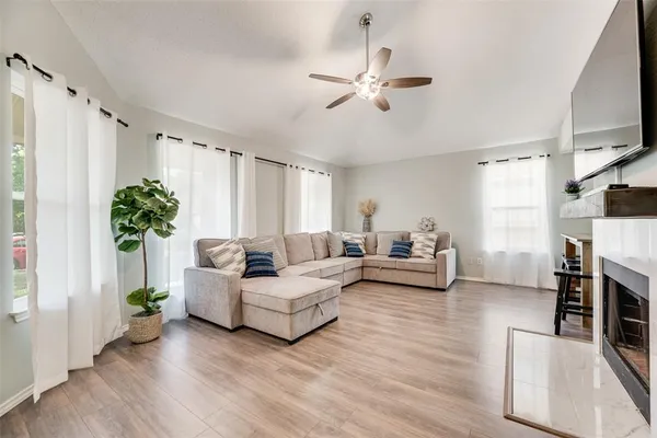a living room with furniture and a large window