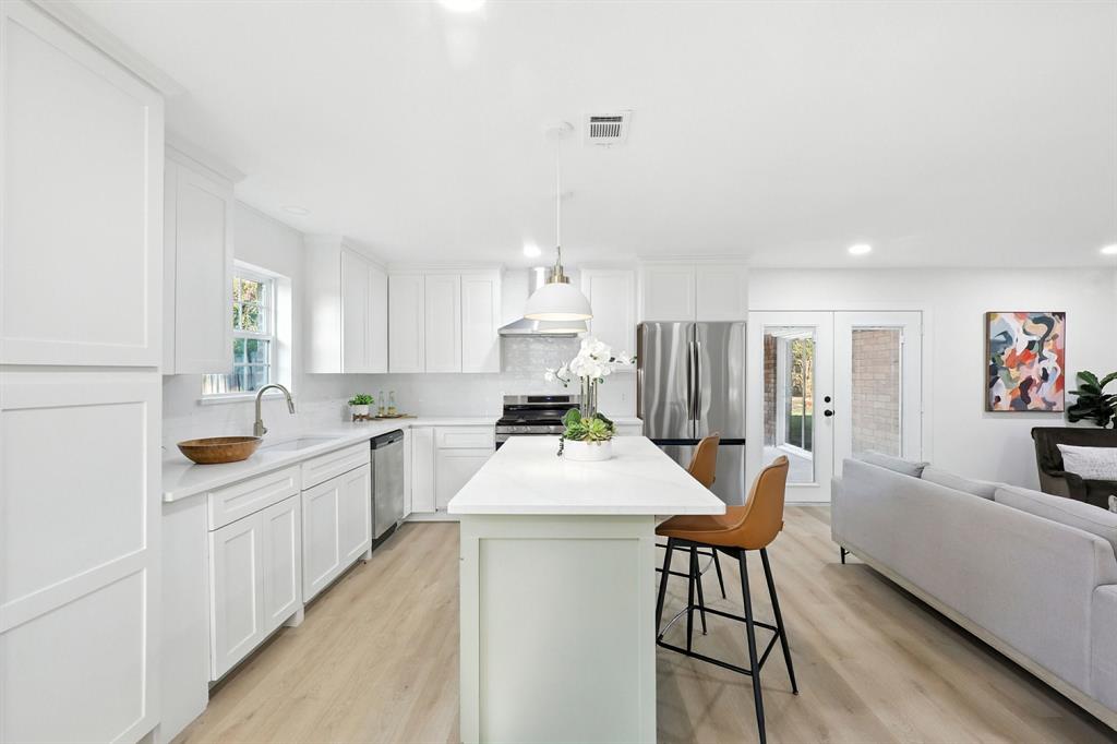 3734 Kimball Ridge Drive Dallas, TX 75233 - Photo 13 of 13 a large kitchen with a table and chairs