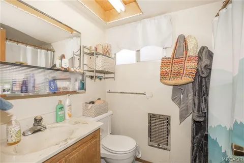 a bathroom with a shower and a bath tub