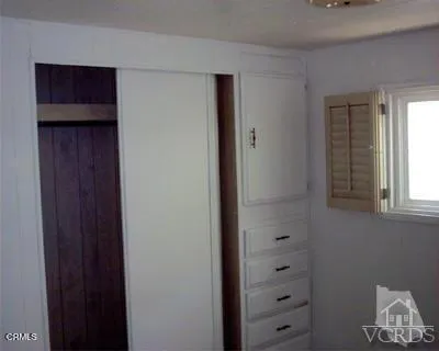 a kitchen with granite countertop a stove and a sink