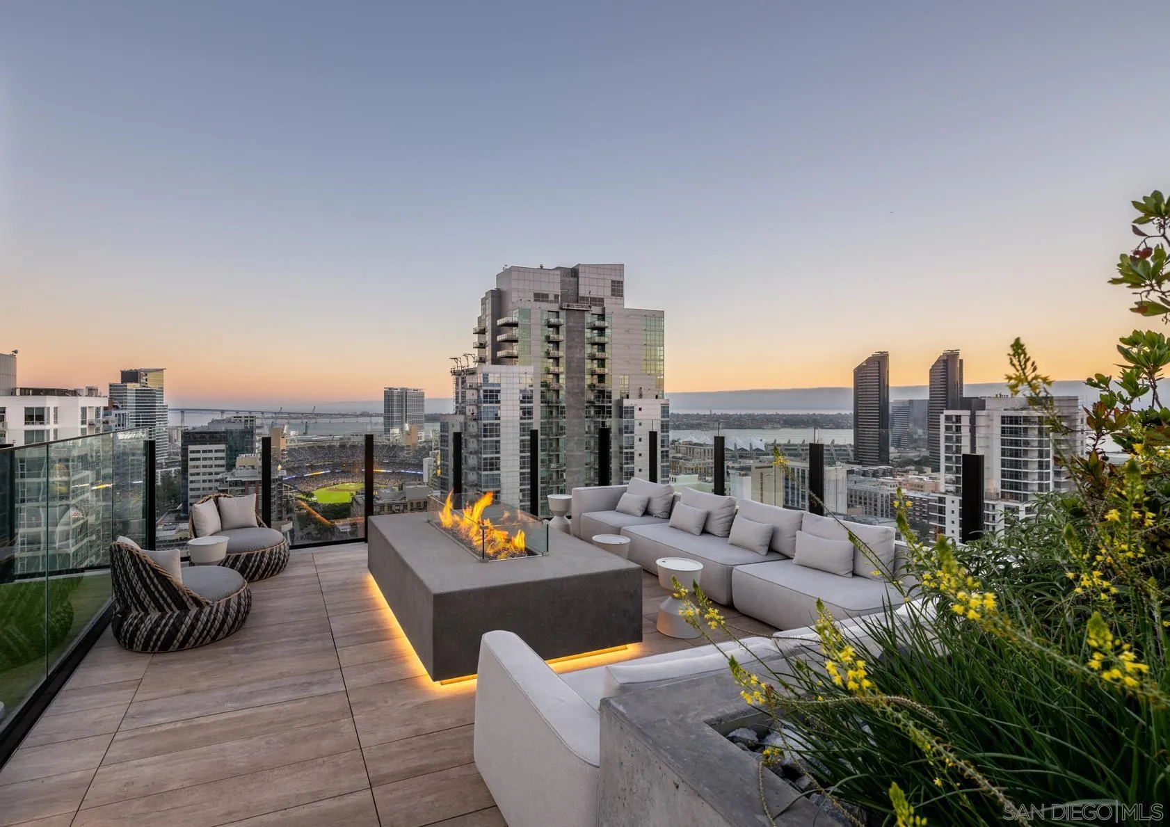 675 Ninth Avenue, Unit 2014 San Diego, CA 92101 - Photo 6 of 12 a view of a roof deck with couches and potted plants