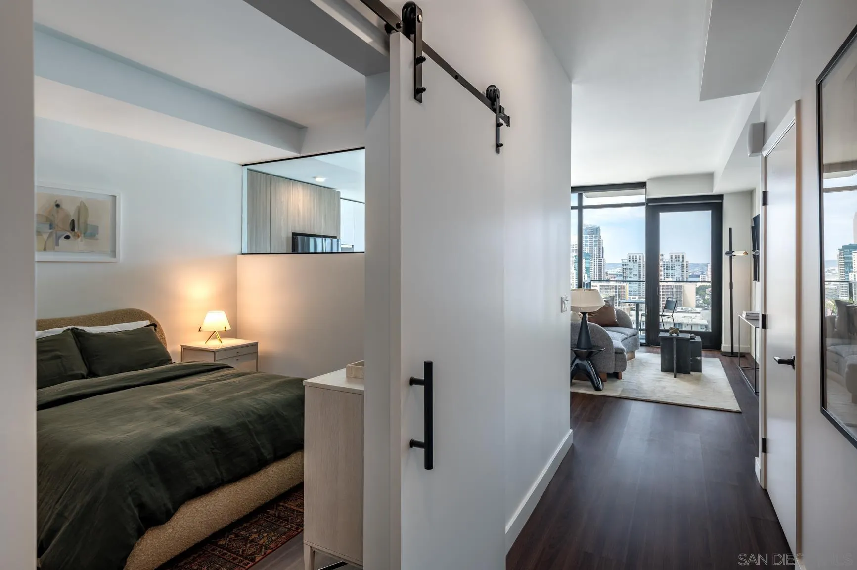 675 Ninth Avenue, Unit 2014 San Diego, CA 92101 - Photo 7 of 12 a bedroom with a bed and a couch