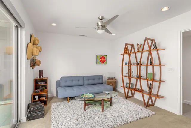 a living room with furniture and a rug