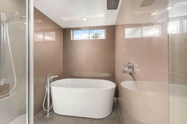 a white bath tub sitting in a bathroom