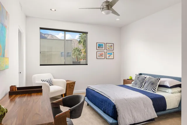 a bedroom with a bed and a couch