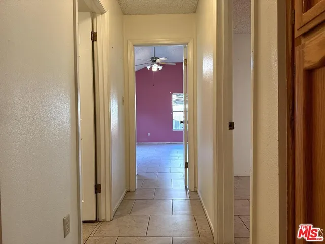 a bathroom with a tub shower and sink