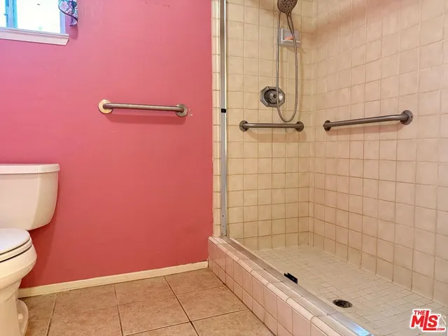 a view of a yard with large trees