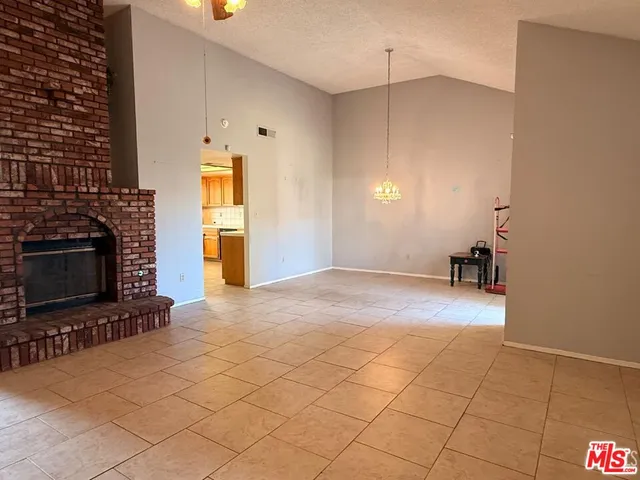 a view of a livingroom with furniture and a fireplace