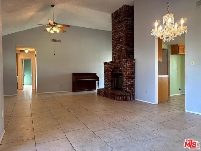 a view of a chandelier in a livingroom with a chandelier