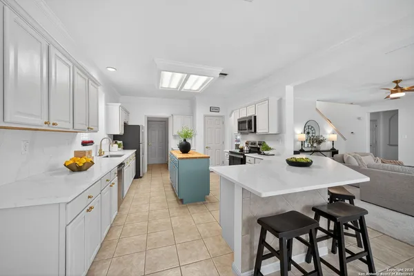 a kitchen that has a table and chairs in it