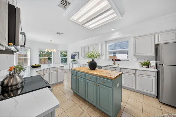 a kitchen with a stove and a microwave