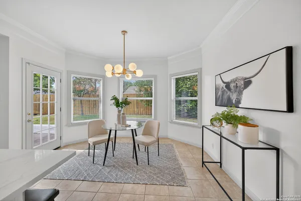 a dining room with furniture and window