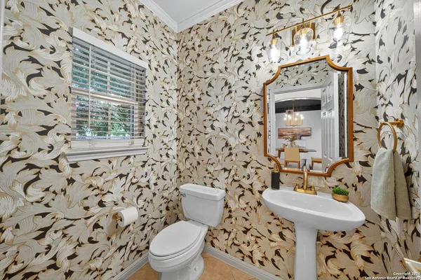 a bed room with a bed and a flat tv screen