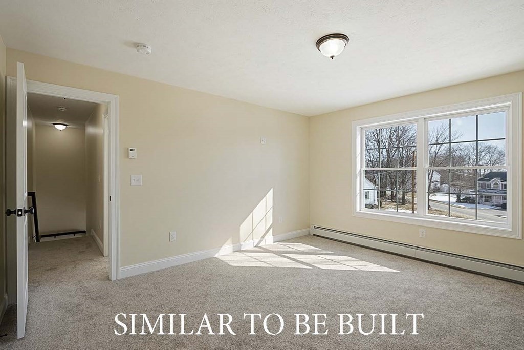 12 Proctor Street Ashburnham, MA 01430 - Photo 4 of 10 a view of an empty room with a window