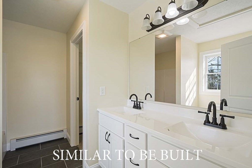 12 Proctor Street Ashburnham, MA 01430 - Photo 6 of 10 a bathroom with a sink and a mirror