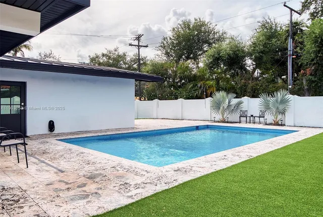 a view of a backyard with a tub